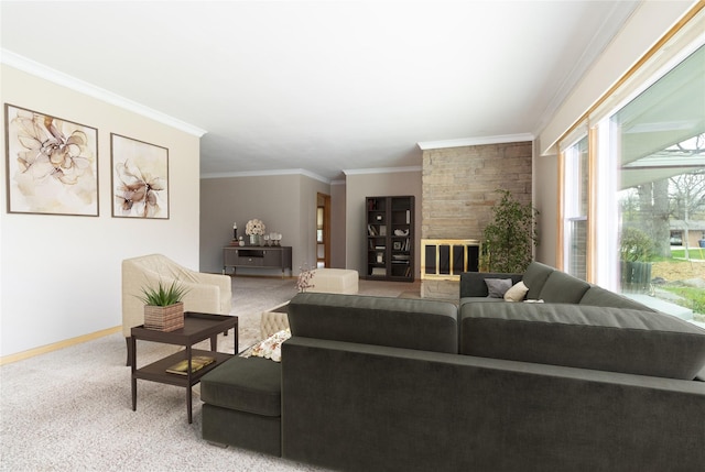 living area with ornamental molding, a wealth of natural light, baseboards, and carpet