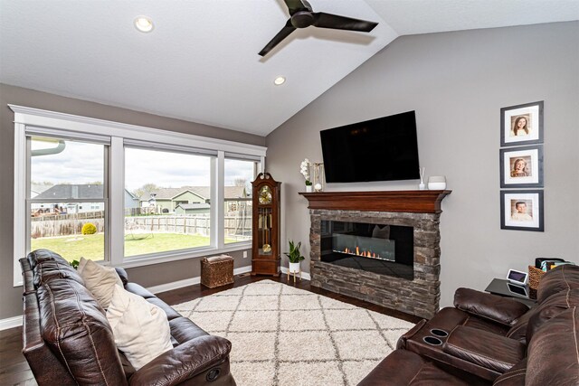 320 Hawthorne Cir, Gilbert, IA 50105 - living area featuring vaulted ceiling, wood finished floors, and a wealth of natural light