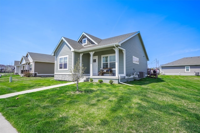2802 SW Prairie Trail Pkwy, Ankeny, IA 50023 - view of front of property featuring a front lawn, covered porch, and central air condition unit