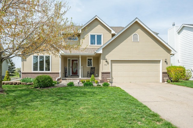 914 NE 9th St, Ankeny, IA 50021 - view of front of house featuring driveway, brick siding, a front yard, and a garage