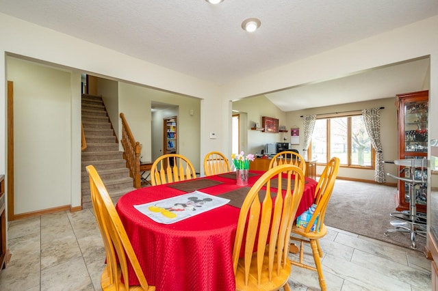914 NE 9th St, Ankeny, IA 50021 - dining area featuring baseboards, stairs, and a textured ceiling