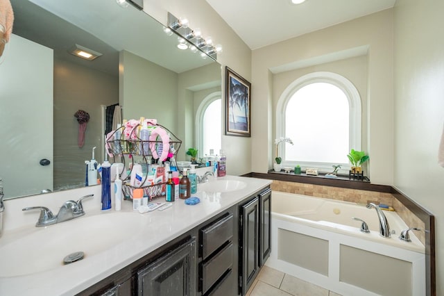 914 NE 9th St, Ankeny, IA 50021 - bathroom featuring a bath, a sink, tile patterned flooring, and double vanity