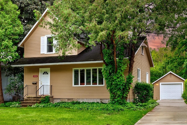 view of front of property with a garage, an outbuilding, concrete driveway, and a front yard