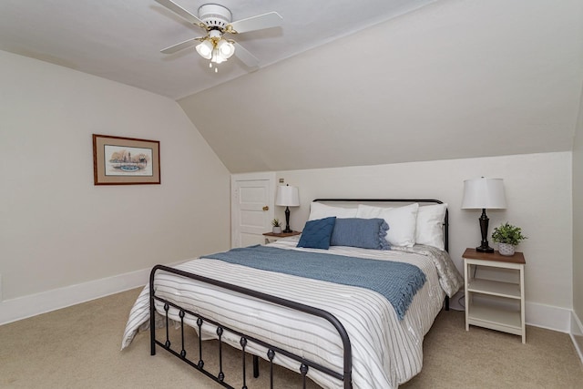 bedroom with lofted ceiling, a ceiling fan, light carpet, and baseboards