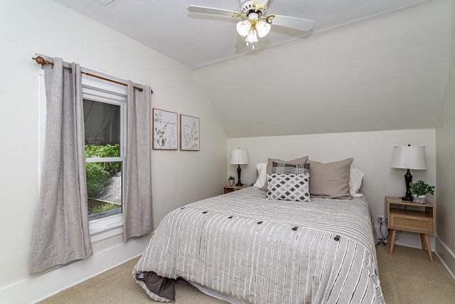 carpeted bedroom featuring ceiling fan and lofted ceiling