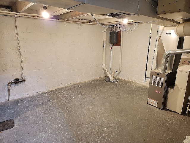 946 Miller Ave, Iowa City, IA 52246 - unfinished below grade area with heating unit and electric panel