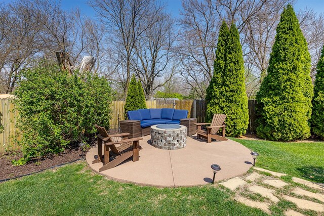 view of patio / terrace with an outdoor fire pit and a fenced backyard