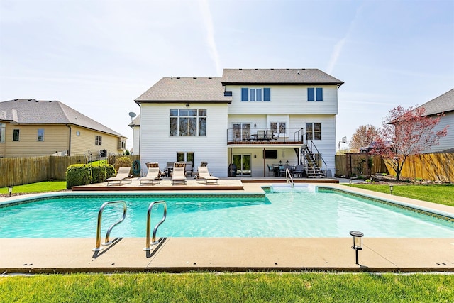 view of swimming pool featuring stairs, a patio, a fenced in pool, a deck, and a fenced backyard