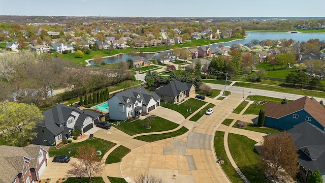 aerial view with a water view and a residential view