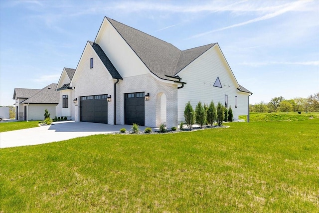 18284 Baxter Pl, Clive, IA 50325 - view of home's exterior with driveway, a lawn, a garage, brick siding, and a shingled roof