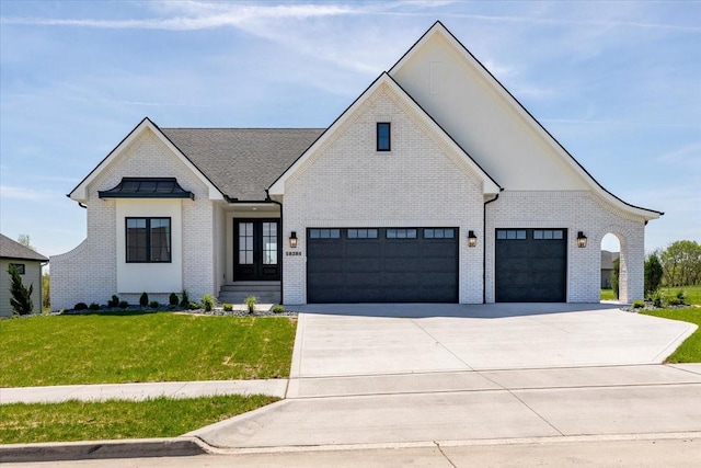 18284 Baxter Pl, Clive, IA 50325 - view of front facade featuring brick siding, a front yard, concrete driveway, and a garage