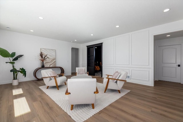 18284 Baxter Pl, Clive, IA 50325 - sitting room featuring wood finished floors, recessed lighting, and baseboards