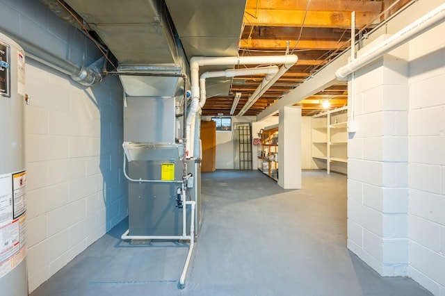 unfinished below grade area featuring heating unit and concrete block wall