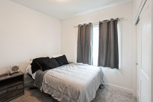 6635 NE 9th Ct, Des Moines, IA 50313 - bedroom with carpet flooring and baseboards