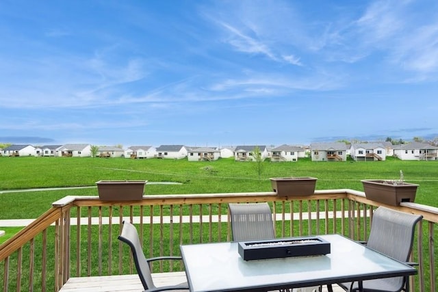 6635 NE 9th Ct, Des Moines, IA 50313 - wooden deck with a residential view, outdoor dining space, and a yard