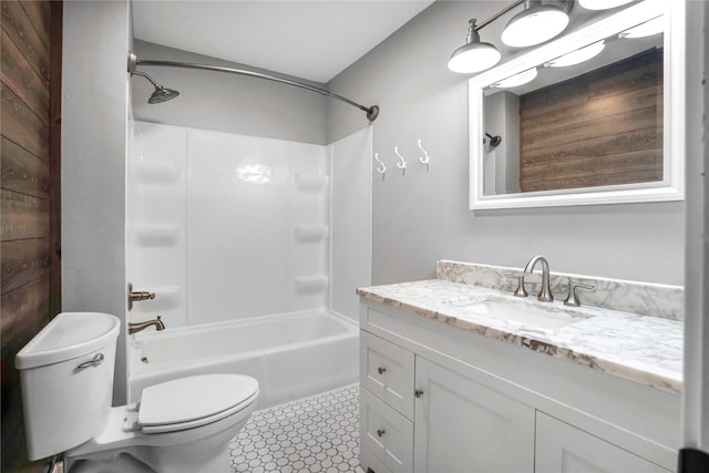 bathroom with vanity, toilet, and shower / bathtub combination
