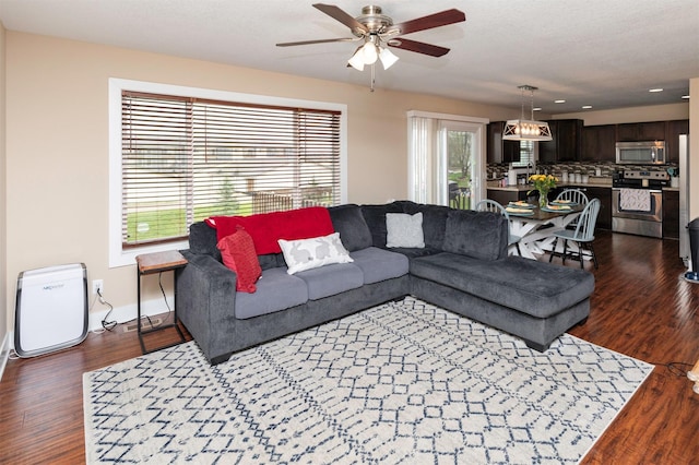 2884 Park Pl, Norwalk, IA 50211 - living room featuring wood finished floors, a ceiling fan, baseboards, and recessed lighting
