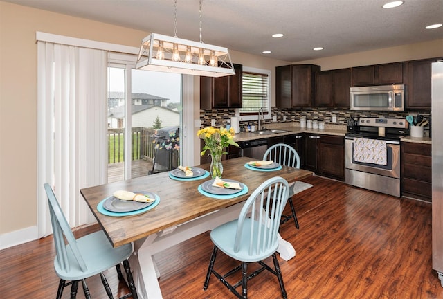 2884 Park Pl, Norwalk, IA 50211 - dining room with dark wood-style flooring and recessed lighting