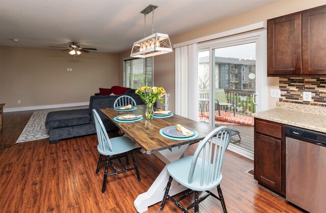 2884 Park Pl, Norwalk, IA 50211 - dining area with a ceiling fan, dark wood-type flooring, and baseboards