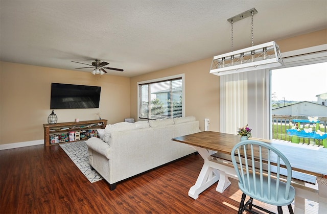 2884 Park Pl, Norwalk, IA 50211 - living room with a ceiling fan, wood finished floors, and a textured ceiling