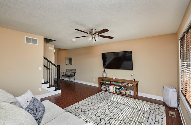 2884 Park Pl, Norwalk, IA 50211 - living area with wood finished floors, a ceiling fan, stairway, and a textured ceiling