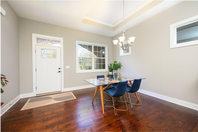 1616 Park Ave, Des Moines, IA 50315 - dining area featuring a chandelier and dark wood-style flooring