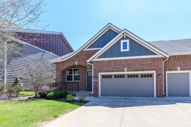 1616 Park Ave, Des Moines, IA 50315 - craftsman inspired home with a garage, brick siding, board and batten siding, and concrete driveway