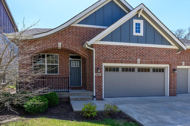 1616 Park Ave, Des Moines, IA 50315 - view of front of home featuring brick siding, board and batten siding, concrete driveway, and an attached garage