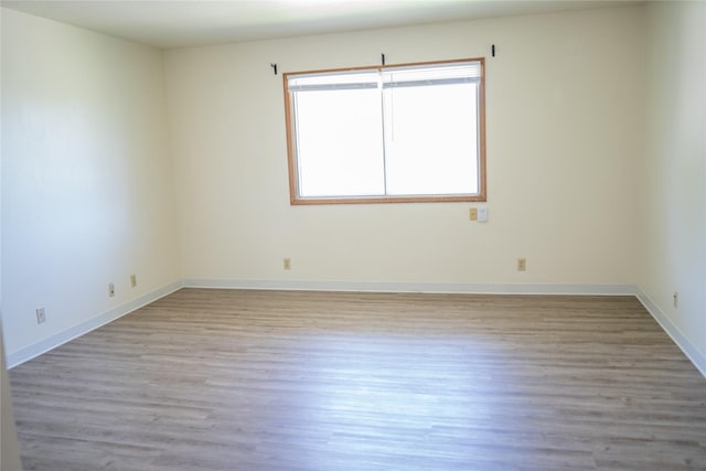 180 1st St, Gilbert, IA 50105 - unfurnished room with light wood finished floors and baseboards