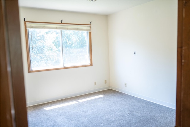 180 1st St, Gilbert, IA 50105 - empty room featuring baseboards and carpet floors