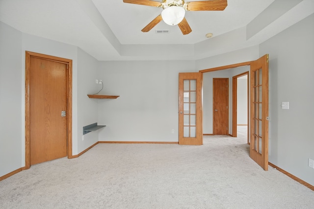 1410 Alderwood Dr, Altoona, IA 50009 - unfurnished living room with carpet flooring, a ceiling fan, visible vents, baseboards, and french doors