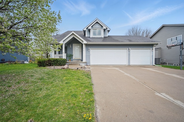 1410 Alderwood Dr, Altoona, IA 50009 - view of front of property with concrete driveway, roof with shingles, central AC unit, a front lawn, and a garage