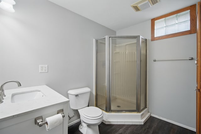 1410 Alderwood Dr, Altoona, IA 50009 - bathroom featuring toilet, visible vents, a shower stall, and wood finished floors