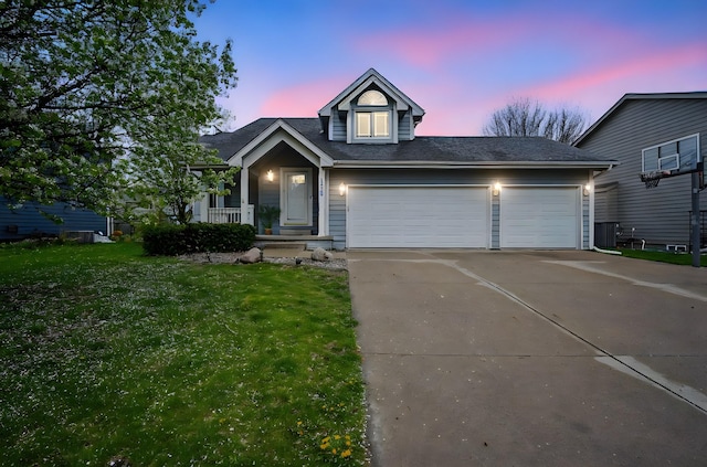 1410 Alderwood Dr, Altoona, IA 50009 - view of front of property with driveway, a front yard, a shingled roof, and an attached garage