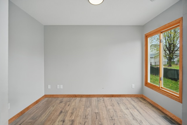 1410 Alderwood Dr, Altoona, IA 50009 - empty room featuring baseboards, light wood-type flooring, and visible vents