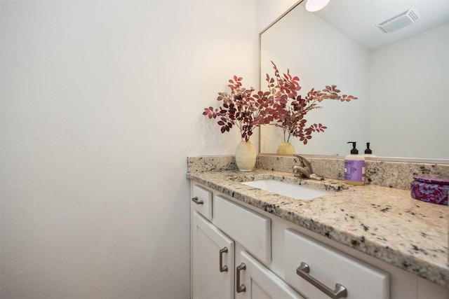 bathroom with visible vents and vanity