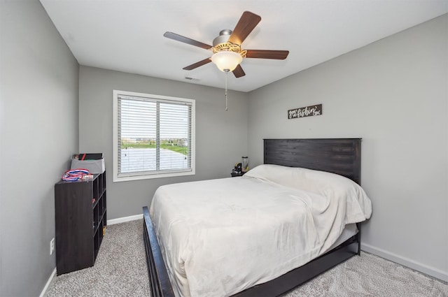 bedroom featuring visible vents, carpet flooring, ceiling fan, and baseboards