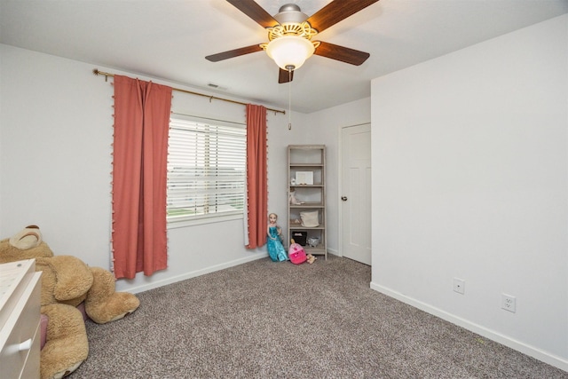 unfurnished bedroom featuring baseboards, visible vents, a ceiling fan, and carpet