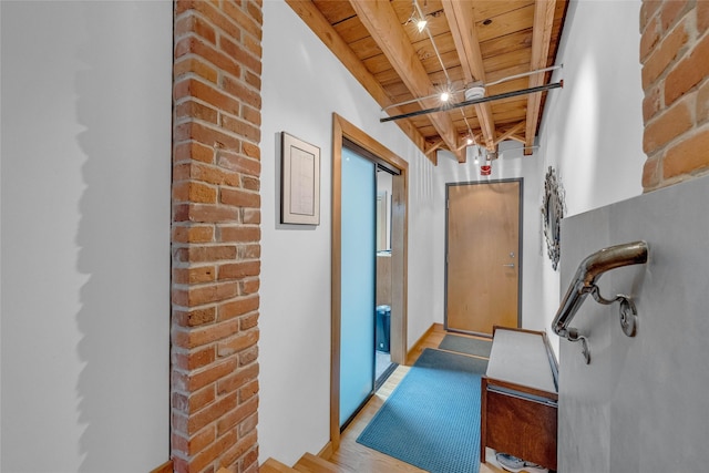 hallway with wooden ceiling and beam ceiling