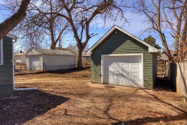 detached garage with fence