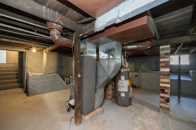 below grade area featuring gas water heater, heating unit, and stairway