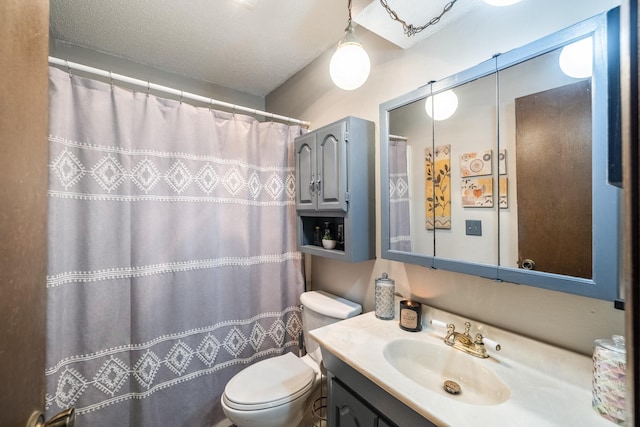 bathroom with toilet, vanity, and a shower with shower curtain