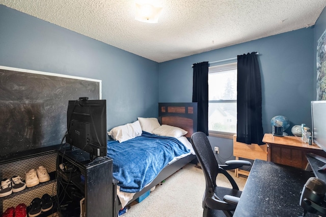 carpeted bedroom with a textured ceiling