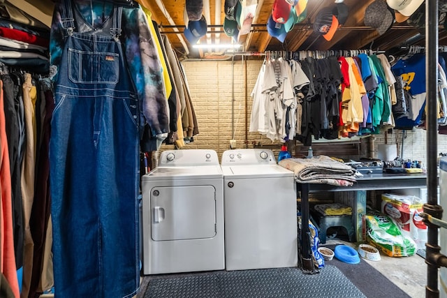 laundry area with washing machine and clothes dryer and laundry area