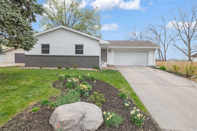 view of front of house featuring concrete driveway, an attached garage, fence, brick siding, and a front lawn