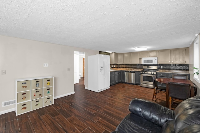 living room featuring baseboards, visible vents, and dark wood-style flooring