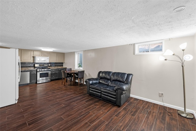 living room with baseboards, a textured ceiling, and dark wood-type flooring