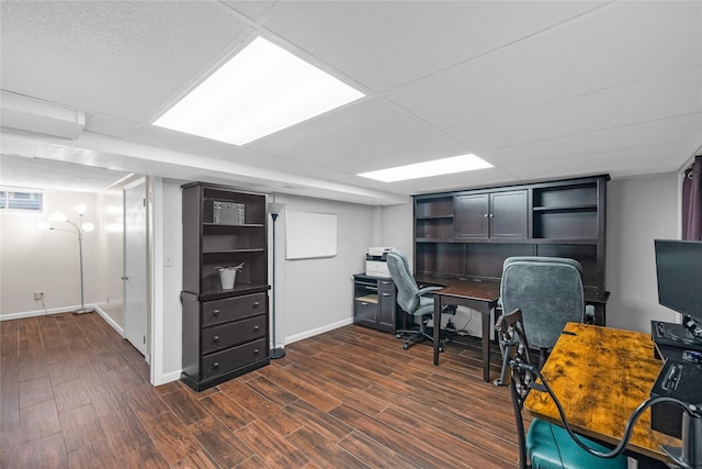 office space with visible vents, dark wood-style flooring, and baseboards