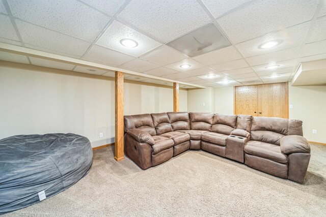 living area featuring recessed lighting, a paneled ceiling, carpet floors, and baseboards