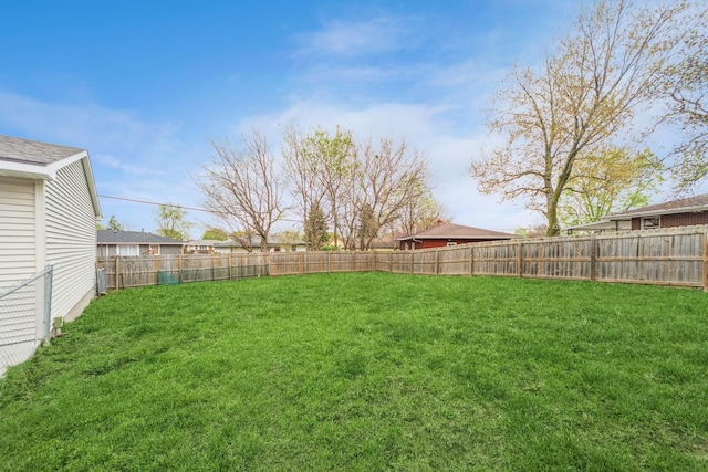 view of yard with a fenced backyard